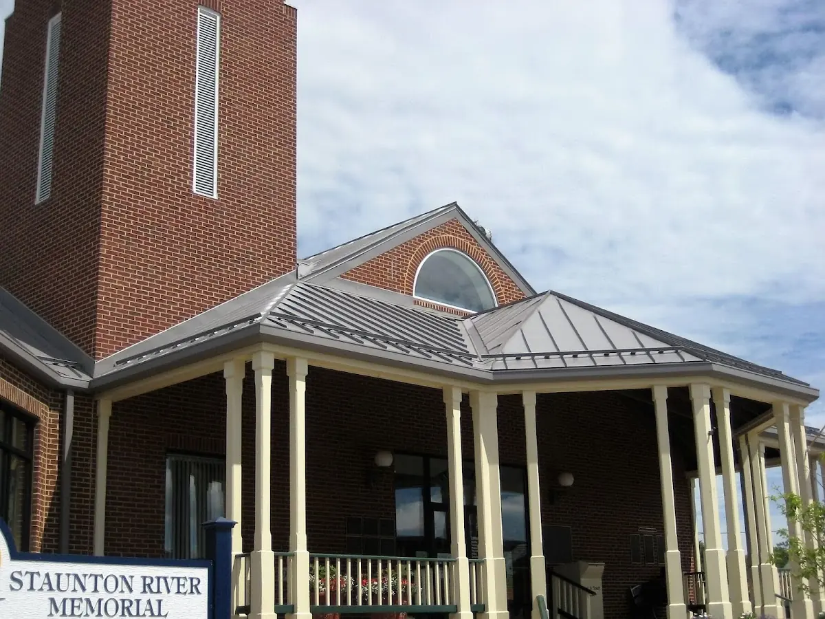 Skilled roofing craftsmen working on a residential roof in Kenton